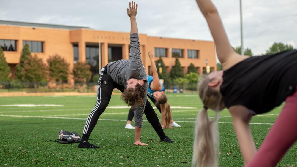 students doing yoga